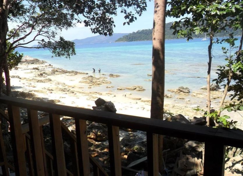 Lipe Sunset Beach Resort on Ko Lipe with beachfront view of clear water, sand, and distant island