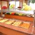 Hotel Aubi in Palamós buffet counter with hot trays, fruit display and serving dishes