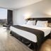 Eurostars Palace Córdoba room with large window, city view and modern bed