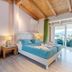 Palapart Gikas Suites And Studios in Gouvia bedroom with balcony view and twin beds