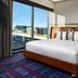 The Rally Hotel at McGregor Square in Denver room with king bed and city view through large windows