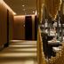 The Mulian Hotel Guangzhou Zhujiang New Town hallway with mirrored gold-toned decorative wall art