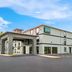 Quality Inn & Suites Biloxi - Ocean Springs exterior with parking lot and covered entrance