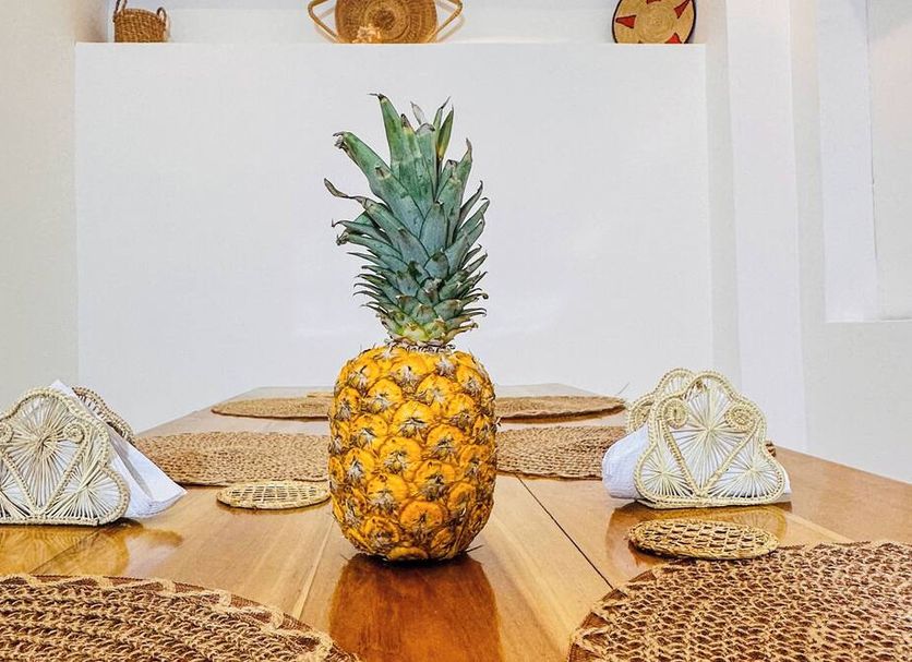 Hostal Casa Torres Centro Historico - Adults Only in Cartagena with pineapple table centerpiece and woven decor