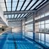 Langham Place, Xiamen indoor infinity pool with floor-to-ceiling windows and city views