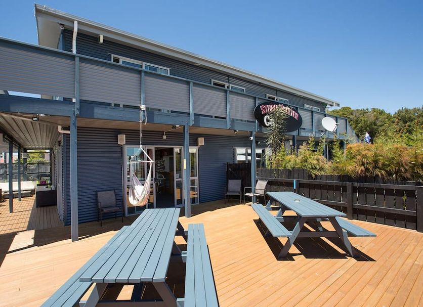 Lknz Lodge & Cafe in Ohakune with outdoor deck seating and mountain lodge exterior