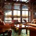 Lake Placid Lodge Lake Placid lounge with leather seating and lake views through large windows