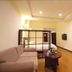 Chengdu Tianfu Lidu Hotel in Chengdu living area with sofa, coffee table and wall-mounted TV