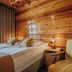 Dom Wypoczynkowy U Staszla in Bańska: cozy wood-paneled room with twin beds and a beige chair