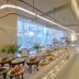 LOTTE CITY HOTEL DAEJEON buffet dining area with long food display and large windows in Daejeon