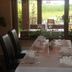 Dining table set by window at Przylądek Daglezja nad Jeziorem Kórnickim in Kórnik, with garden view.