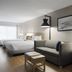 Hyatt Place Atlanta/Alpharetta/North Point Mall guest room with bed, sofa, desk and window