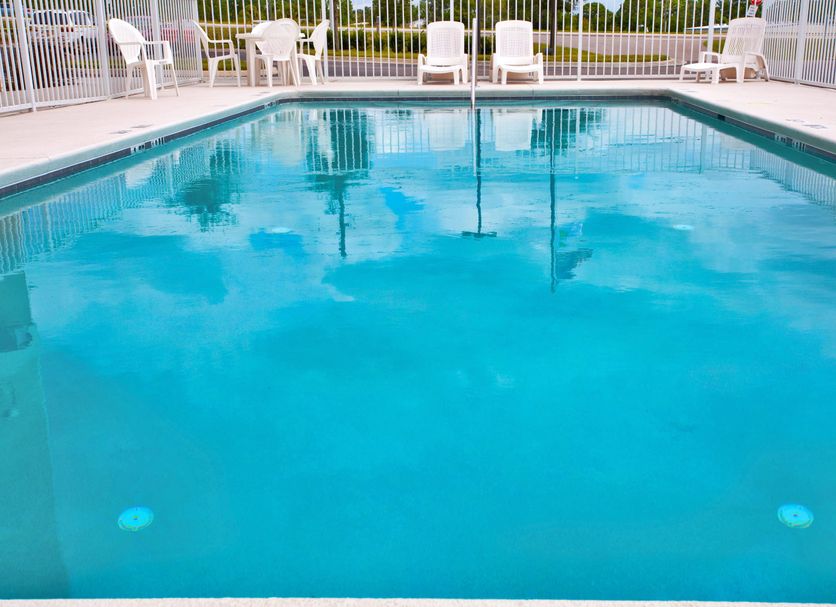 Holiday Inn Express & Suites Brooksville West pool with lounge chairs in Brooksville