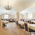 Hotel Bergjuwel in Neustift im Stubaital dining room with chandeliers, arched ceilings and set tables