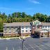 Holiday Inn Express & Suites Zanesville North exterior with covered entrance and parking lot in Zanesville