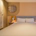 Home Inn Dalian Jinzhou Railway Station Stadium guest room with double bed and bedside lamps in Dalian