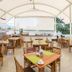 Hotel Del Pescador in Ajijic open-air restaurant with wooden tables and hillside views