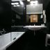 Mediterranea Hotel & Convention Center Salerno bathroom with bathtub, sink, mirror, towel rack, and stool