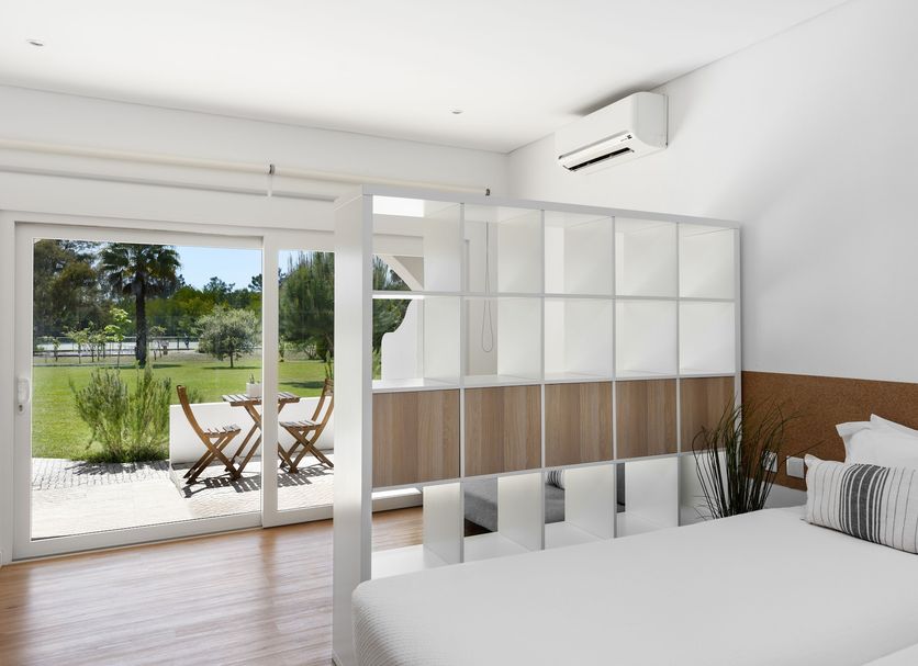 Quinta Do Moinho De Vento - Racket & Country Club - Duna Parque Resorts & Hotels room with sliding doors to patio and garden views in Vila Nova de Milfontes