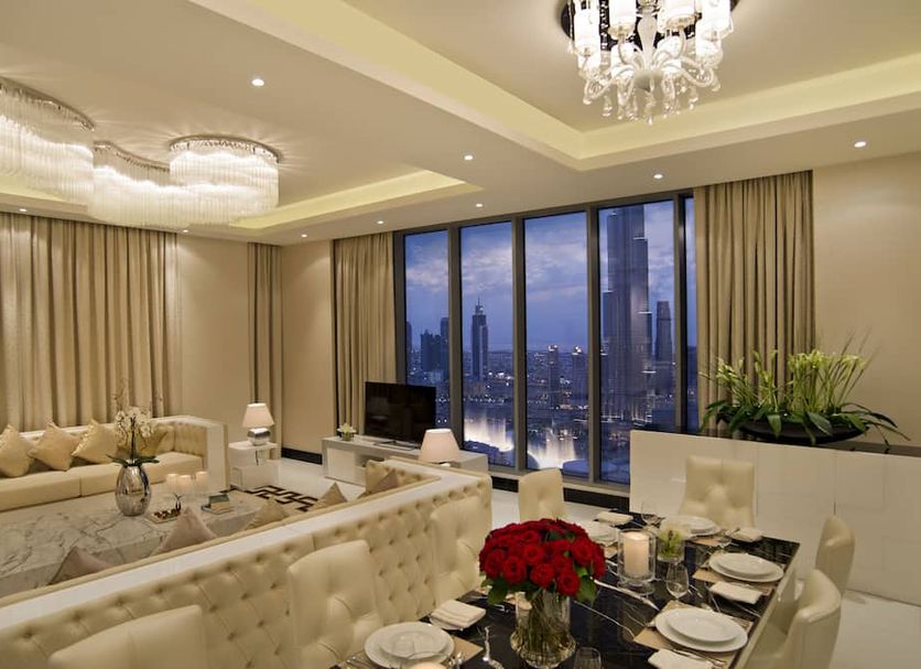 DAMAC Maison Dubai Mall Street in Dubai, luxury suite with city skyline view and chandelier