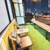 The Yak Cozy Chiang Mai rooftop terrace with benches and city night views in Chiang Mai