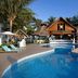 Margaritaville Island Reserve Riviera Cancun in Puerto Morelos with a lagoon-style pool and palm trees