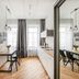 Piano Apartments in Kaunas studio with bed, dining table, kitchenette and mirrored wardrobe