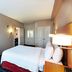 TownePlace Suites by Marriott Tulsa North/Owasso guest room with king bed, TV, and dresser in Owasso