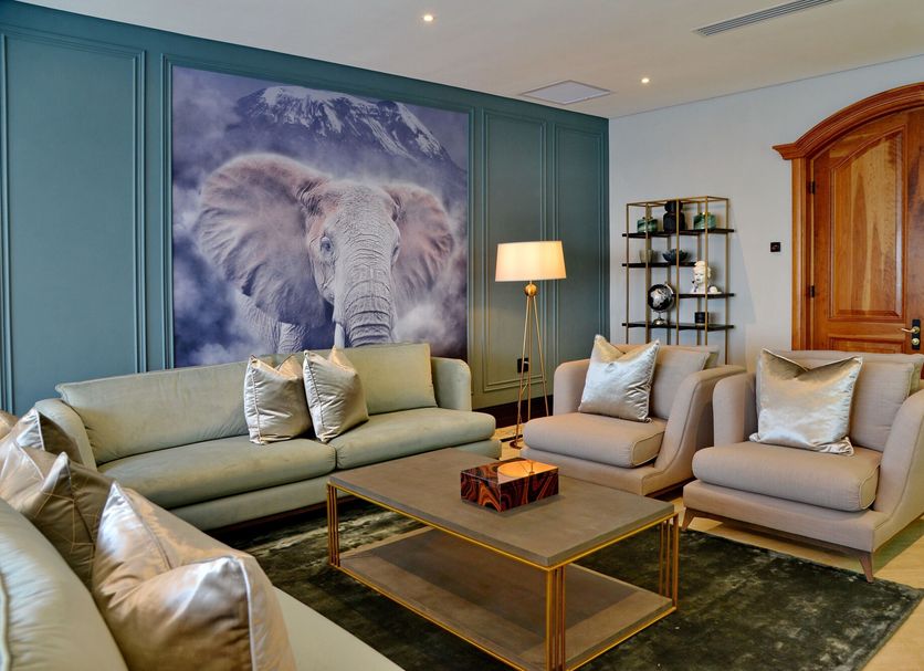 Apogee Boutique Hotel & Spa in Pretoria lounge with elephant wall art, sofa and armchairs