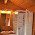 Lagrange Vacances Les Ségalières in Gramat: wood-paneled bathroom with shower stall and sink