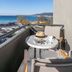Hotel Nafpaktos balcony with table, chairs and sea view in Nafpaktos