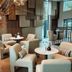Vann Spa Hotell & Konferens in Brastad lounge with cream chairs, round tables and floor-to-ceiling windows