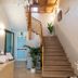 Hotel Residence Sestriere in Moncalieri lobby with staircase, chandelier, reception desk and potted plants