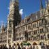 Empress Hotel Munich exterior near ornate Gothic city hall and square