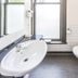 Rutland Arms Inn Whanganui bathroom with vessel sink, wall-mounted toilet and frosted window