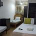 Beach Hotel Jacuma in João Pessoa guest room with bed, twin bed, wardrobe, wall-mounted TV and mirror