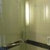 Hotel Menara Bahtera Balikpapan bathroom shower with glass enclosure and wall-mounted grab bar