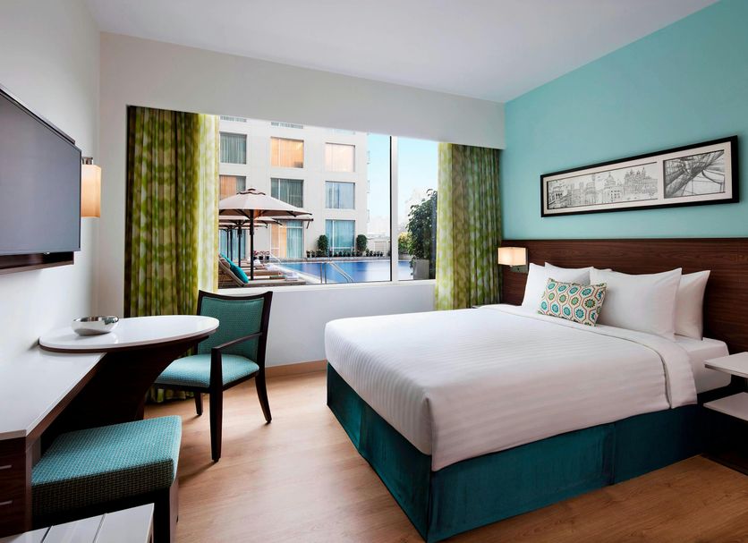 Fairfield by Marriott Bengaluru Outer Ring Road guest room with king bed and pool view in Bengaluru