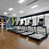 Residence Inn by Marriott Knoxville Downtown fitness room with treadmills, weights, and wall art