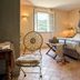 Hôtel-Spa Le Saint Cirq room in Bouzies with four-poster bed, open window and terracotta tile floor