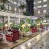 Rixos President Astana atrium lounge in Astana with seating, lamps and indoor palm trees