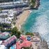 Sosua By The Sea in Sosúa with a beachfront cove, sandy shore, and ocean views