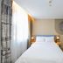 Home Inn Dalian Jinzhou Railway Station Stadium guest room with double bed and large window