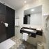Rias Bajas Pontevedra bathroom with glass shower, black vanity, mirror and patterned tile floor