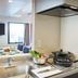 Koko Hotel Osaka Namba Sennichimae kitchen view with sink, stovetop, dining table and TV in Osaka
