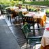 Hotel Ristorante Vecchia Riva in Varese: outdoor terrace dining tables with flowers and chairs