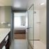 Residence Inn by Marriott Denver Central Park bathroom with vanity and glass shower door leading to bedroom