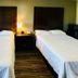 Catalina Airport Motel in Indianapolis room with two double beds and bedside lamp