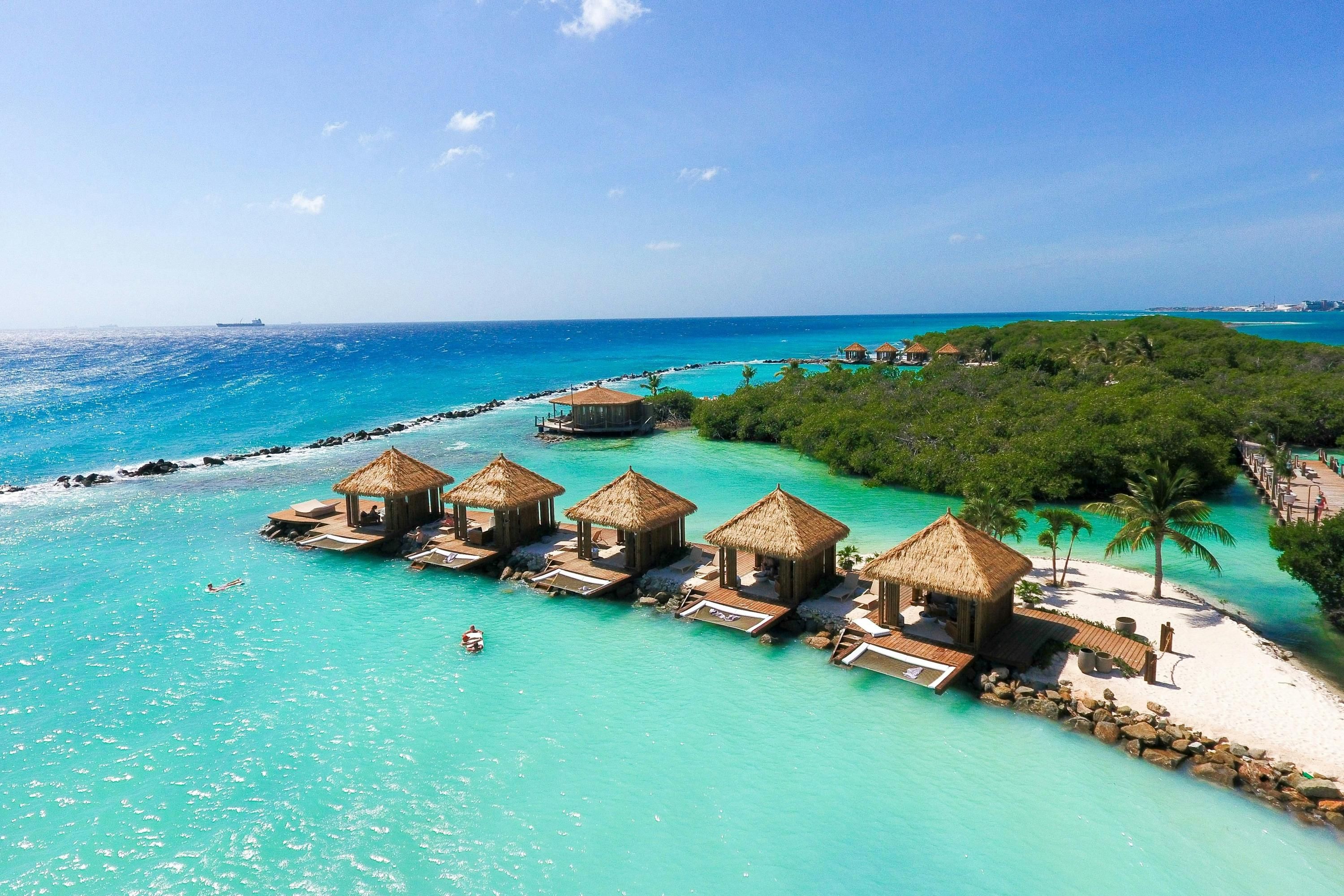 Renaissance Wind Creek Aruba Resort in Oranjestad with overwater villas and turquoise lagoon