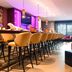 NYX Hotel Mannheim by Leonardo Hotels bar lounge with high stools and colorful modern seating in Mannheim
